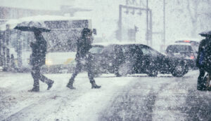 Pedestrians crossing the street on a winter day | Winter Safety Tips
