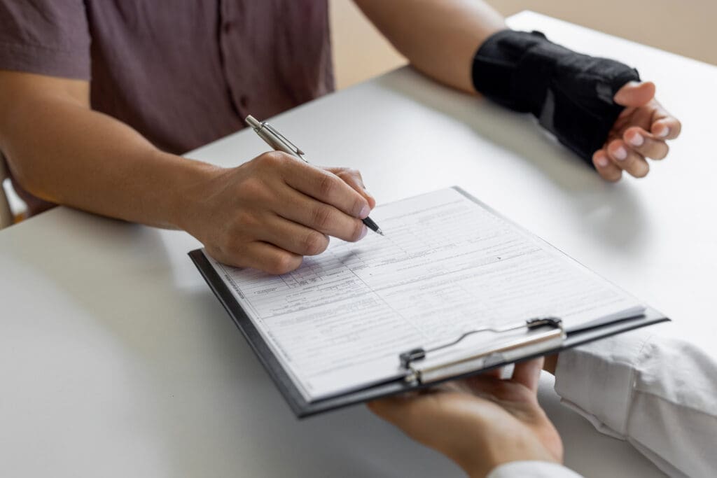Injured party filling out paperwork for swimming pool accident liability